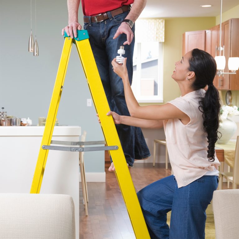 woman helping man with home improvements